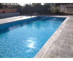 Terreno con piscina y edificación