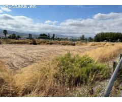Terreno rústico en la entrada de Huétor Vega: Inversión con vistas a Granada.