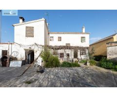 CASA CORTIJO CON PARCELA RÚSTICA DE RIEGO
