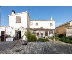 CASA CORTIJO CON PARCELA RÚSTICA DE RIEGO
