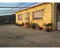 parcela de mangos con casa