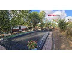 PARCELA CON VIVIENDA Y PISCINA A LA VENTA