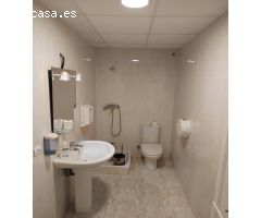 Planta baja para oficina, local comercial o almacén en Xirivella de 116 m2 con dos persianas.