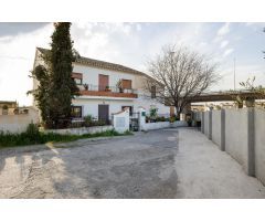 CASA CORTIJO CON PARCELA RÚSTICA DE RIEGO