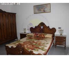 Casa independiente con huerto y cochera.