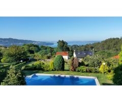Preciosa casa de estilo indiano con piscina y vistas a la ría