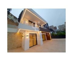 Villa duplex en primera línea de playa con piscina