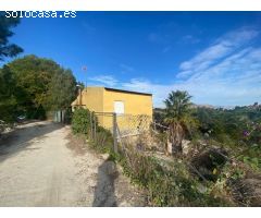 Terreno rústico 6.552m2 con una casa