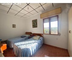 Terreno rústico 6.552m2 con una casa
