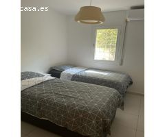 Bajo con terraza y piscina
