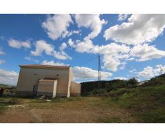 TERRENO RÚSTICO CON VIVIENDA