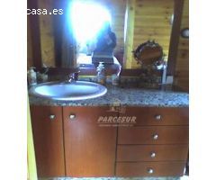 PARCELA CON CASA DE MADERA- Parcela de terreno de 3000 m2 y casa madera maciza amueblada de 135 m2