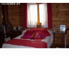 PARCELA CON CASA DE MADERA- Parcela de terreno de 3000 m2 y casa madera maciza amueblada de 135 m2