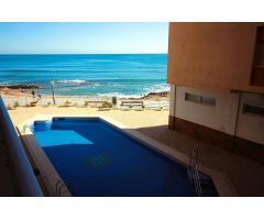 En 1º linea de playa con piscina