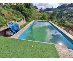 Encantadora casa de una planta en plena naturaleza, rodeada de montaña