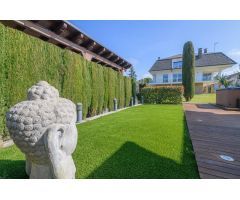 Espectacular casa con jardín