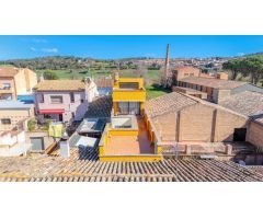 ¡Descubre Tu Nuevo Hogar en La Bisbal! – Espaciosa Vivienda con Local Comercial y Garaje