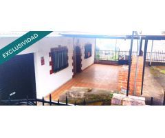 Parcela con vivienda de tes dormitorios, baño, salón, dos cocinas, cochera, tres plantas, dos sótano