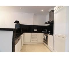 Apartamento de 2 dormitorios en Benissa Costa, con piscina comunitaria y vistas parciales al mar, a 