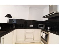 Apartamento de 2 dormitorios en Benissa Costa, con piscina comunitaria y vistas parciales al mar, a 